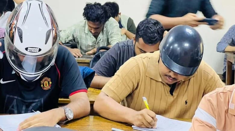হেলমেট পরে পরীক্ষার  হলে জবি শিক্ষার্থীরা !